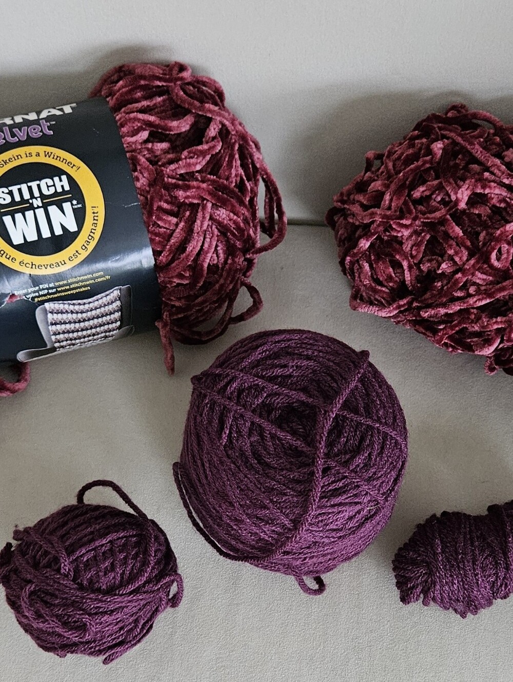 Bernat Velvet Cabernet -1 full/1 /partial skeins plus 2 unspecified skeins.